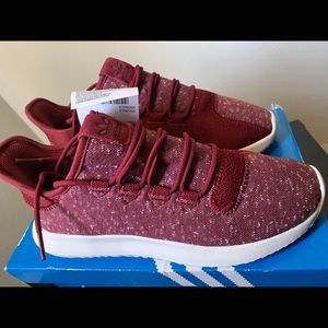 adidas tubular shadow trainers in burgundy.